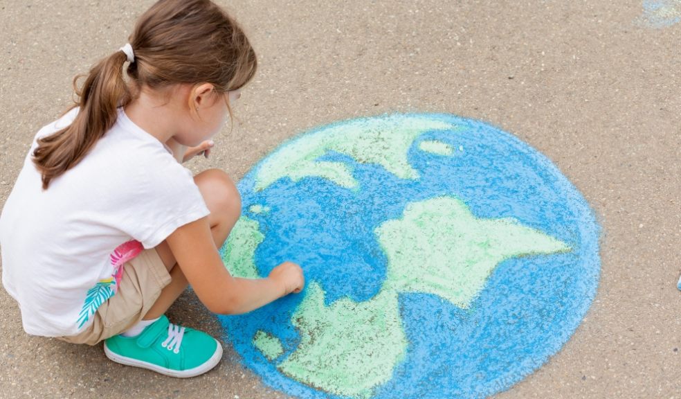 Family. A girl draws a planet of the world with colored chalk on the asphalt. Children’s drawings, paintings and concepts. Education and art, be creative when you return to school. earth, Peace day. jpg  PICTURE: Getty Images/iStockphoto