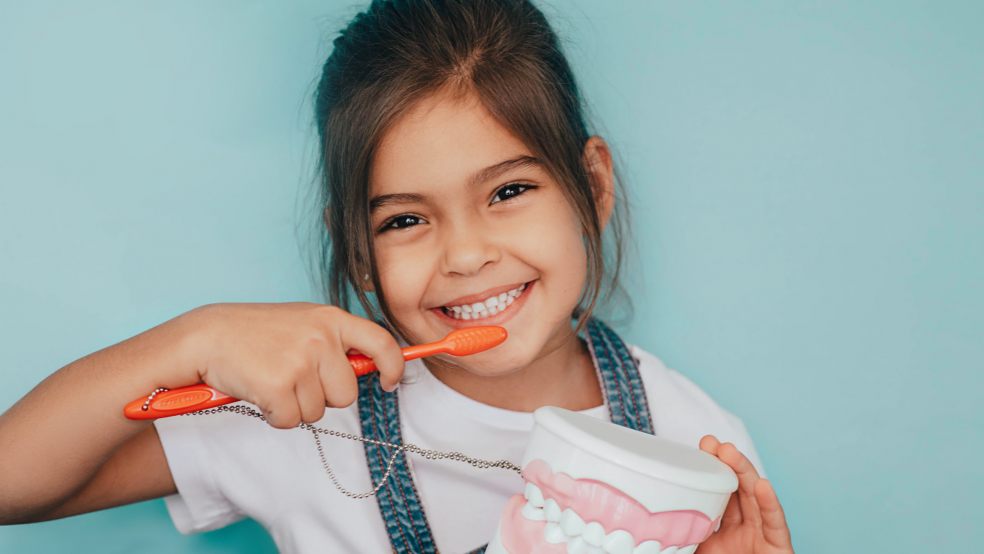 kid brushing teeth