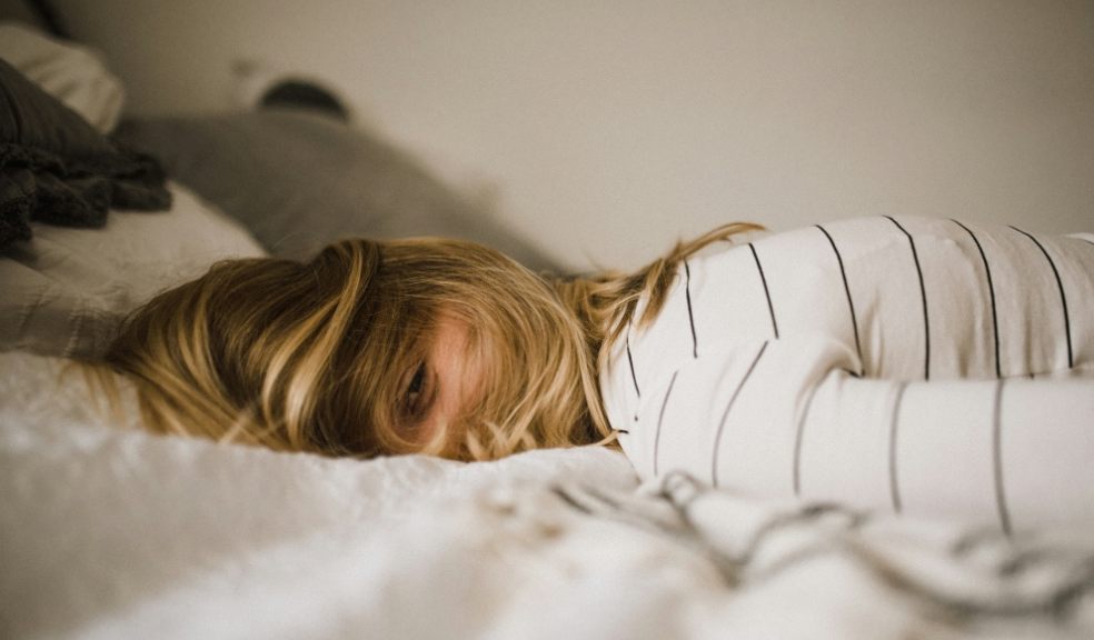 Brits regularly Google sleep questions A woman lying awake on a bed