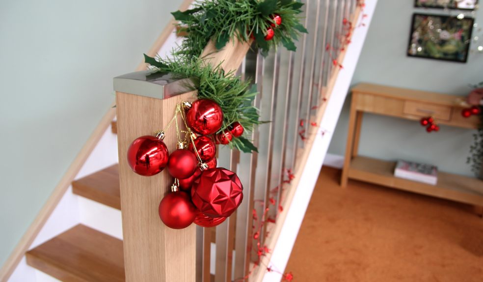 Staircase with Christmas garland and baubles