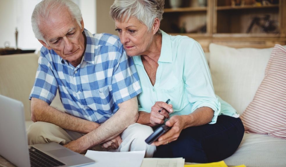 Couple checking laptop. Coronavirus scam. Fraudsters.