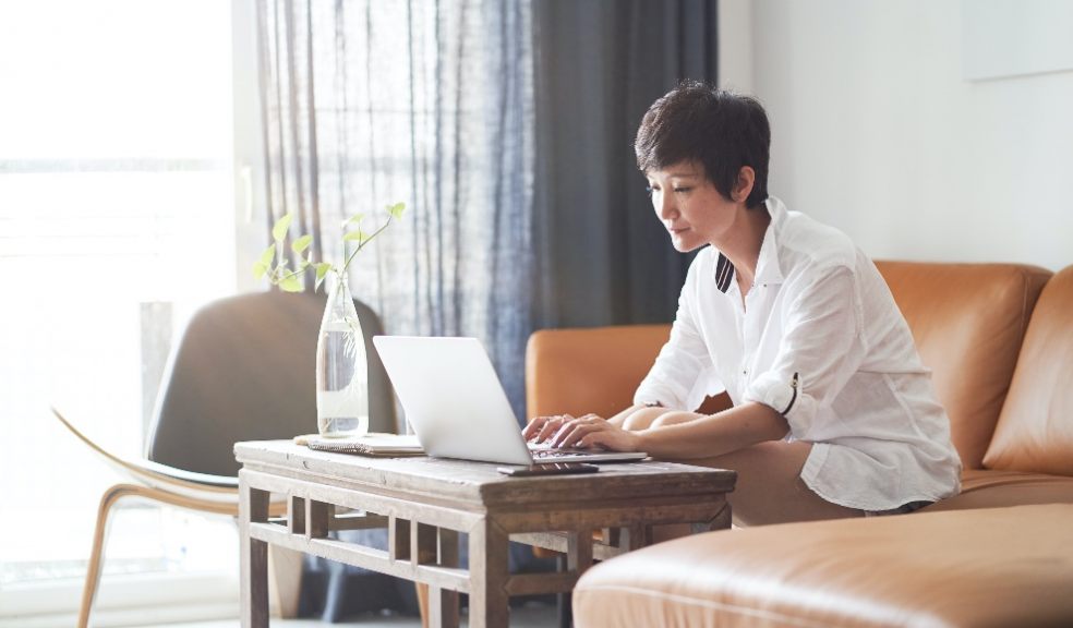 Lady at her laptop worried about money