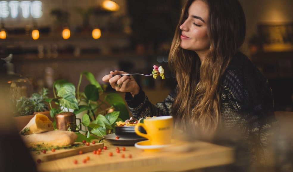 Lady eating at restaurant