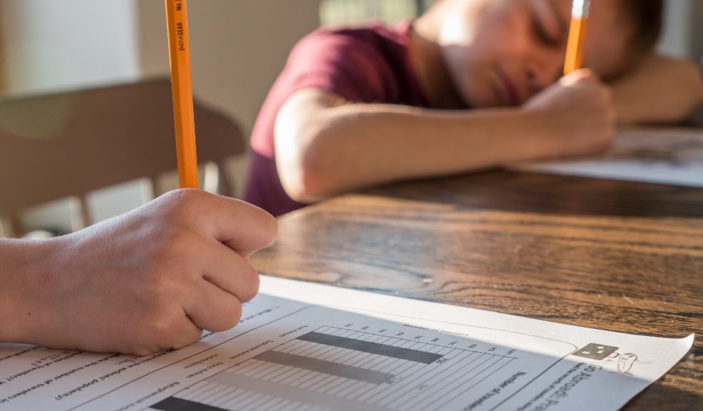Parent and child spending family time home schooling. Parent and child spending family time home schooling.