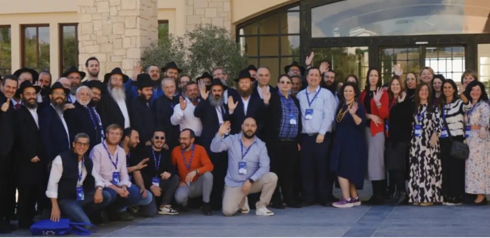 Group photo from a Yael Foundation event with attendees gathered outside the venue.