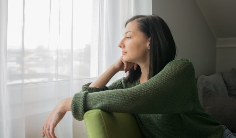 Tenage girl staring out f window. Sad at being alone during Coronavirus. Getty Images/iStockphoto