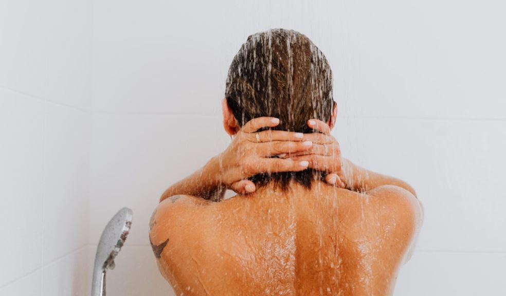 Cranking up the heat could be taking a toll on your hair and scalp A woman washing her hair in the shower