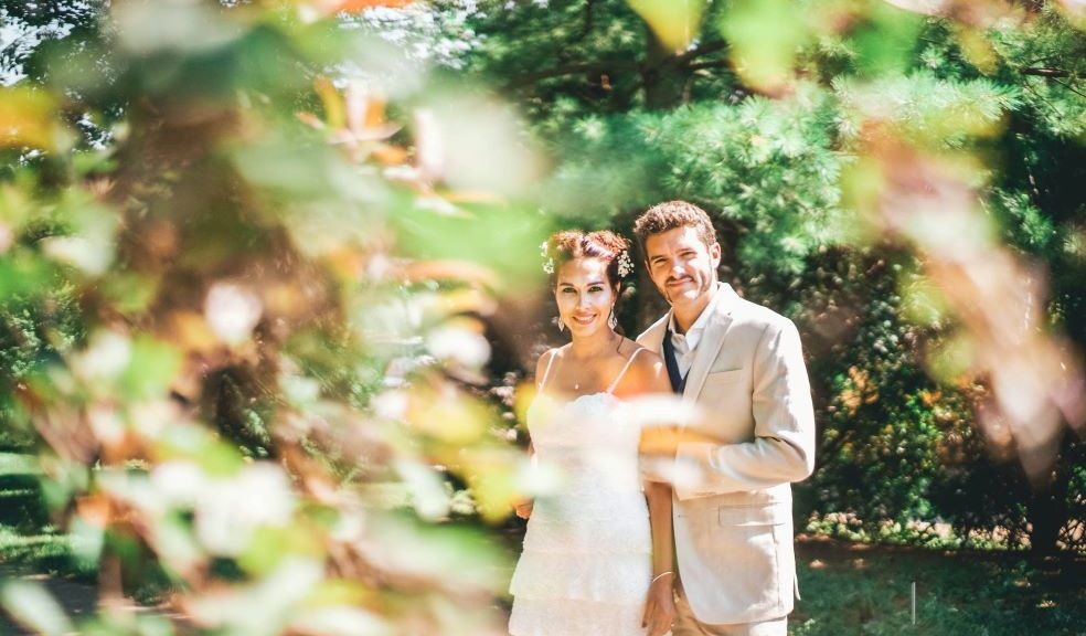 a couple on their wedding day, the sun is shining, the couple are happy