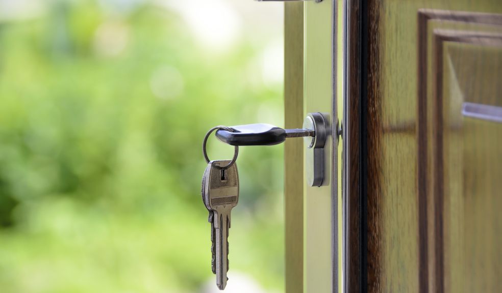 Front door with a key in the lock