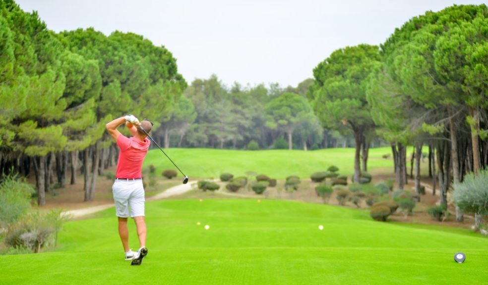 man playing golf on a green