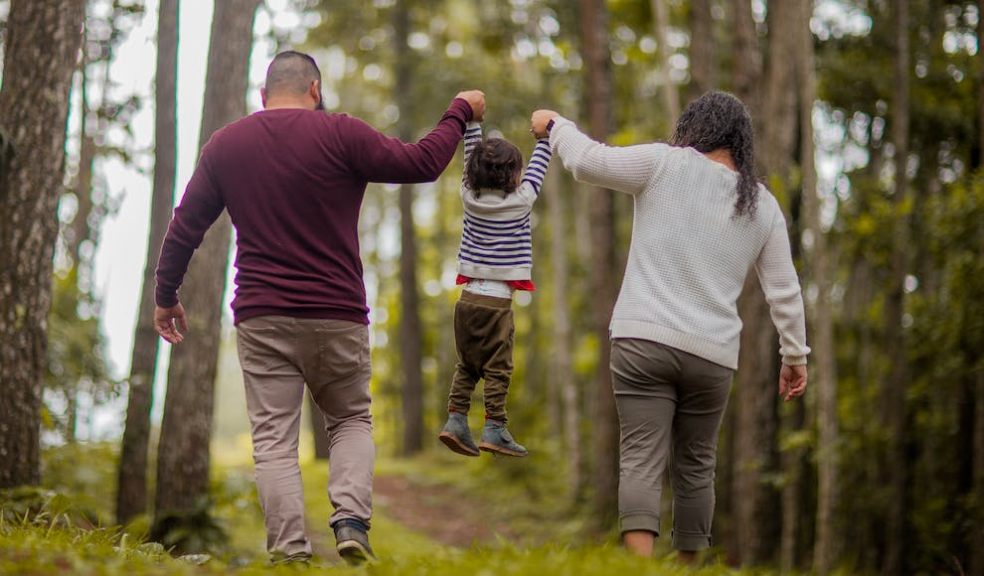 parents out with child  walking