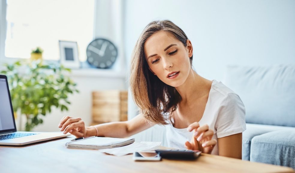 woman with money worries reviewing finances