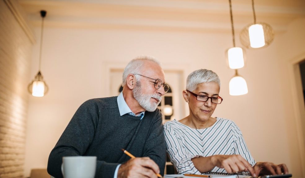 elderly couple checking their home finances