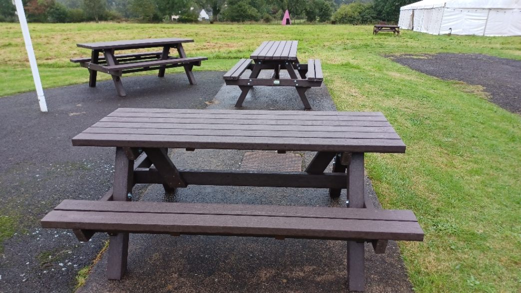 recycled plastic picnic tables in a garden