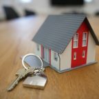 Many homebuyers report being catfished A model of a house with a key
