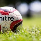 football on grass pitch