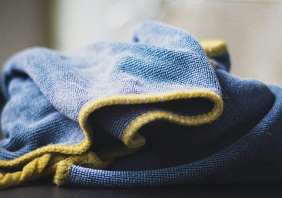 A blue polishing cloth on a table