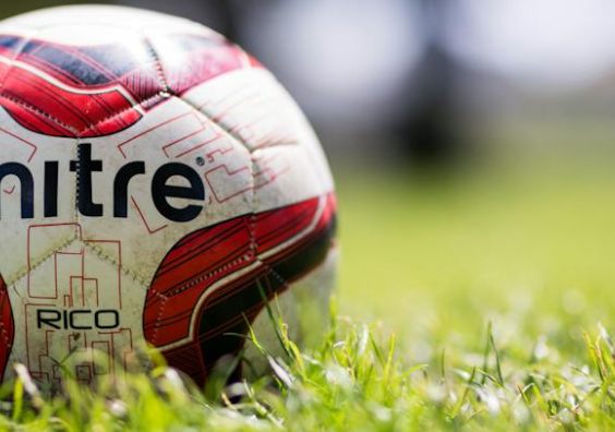 football on grass pitch
