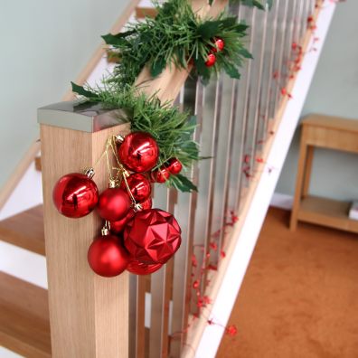Staircase with Christmas garland and baubles