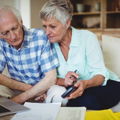 Couple checking laptop. Coronavirus scam. Fraudsters.