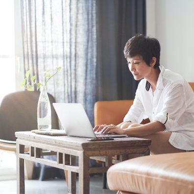 Lady at her laptop worried about money