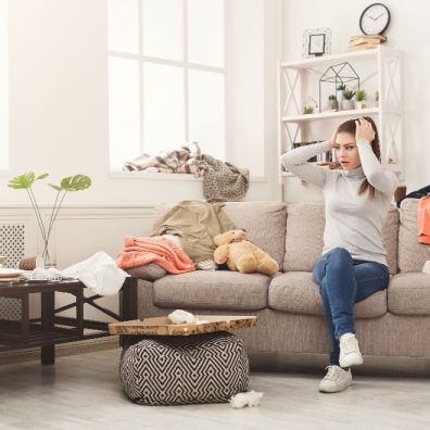 Lady at home with hands on her head