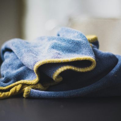 To spray or not to spray? A blue polishing cloth on a table