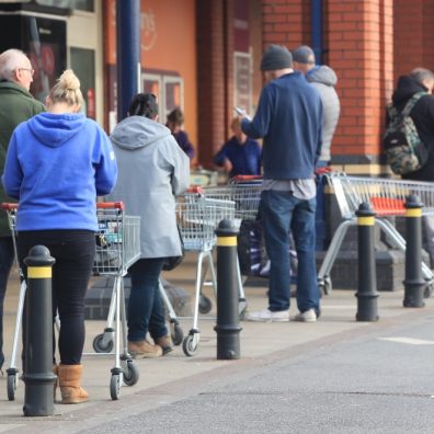 Will supermarket workers be able to keep two metres away from customers? Family (Danny Lawson/PA)