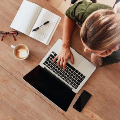 Woman surfing internet at coffee shop