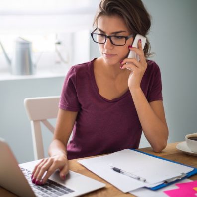 Woman-wearing-glasses- at-computer-checking-finances-lifestyle