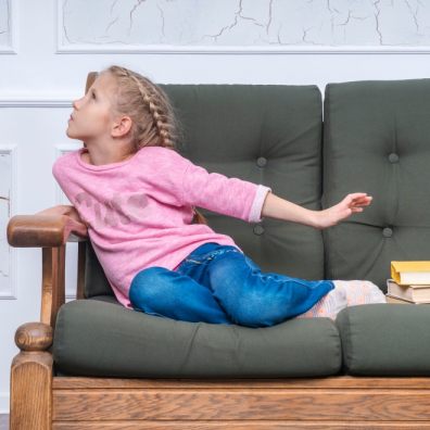 Young girl reluctant to do homework.Family. Getty Images/iStockphoto