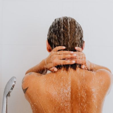 A woman washing her hair in the shower