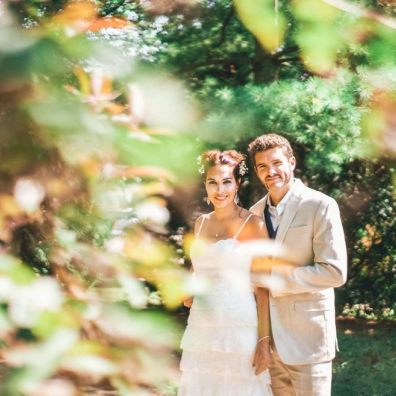 a couple on their wedding day, the sun is shining, the couple are happy