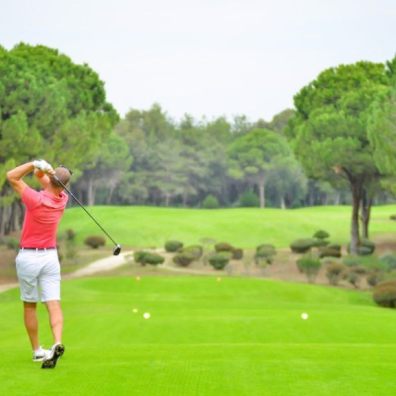 man playing golf on a green