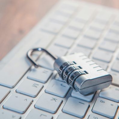 A padlock on a computer keyboard